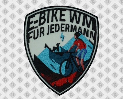 Gestickter Aufnäher E-Bike WM für Jedermann – sportlicher Patch mit Radfahrerin und Bergmotiv