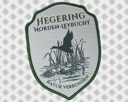 Gestickter Aufnäher Hegering Norden-Leybucht mit Teichmotiv und Ente – Schildform mit grünem Rand