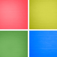 Beispiel einiger UV-aktiven Webgarne - vier Farben: Rot, Gelb, Grün und Blau