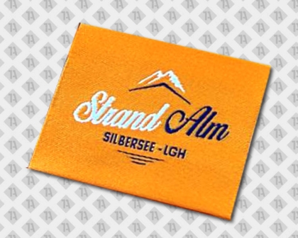 Label gewebt mit Laserschnitt bunt Schriftzug Strandalm