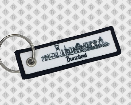 Schlüsselanhänger mit Skyline Burscheid – schwarz-weiß, Kettelrand, rechteckig