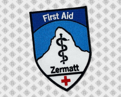 Gestickter runder Patch Aufnäher mit Kettelrand weiß blau von First Aid Zermatt Rettungsdienst