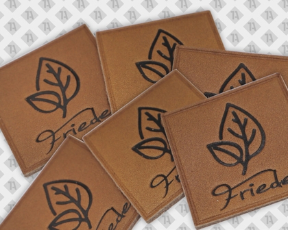 Eckiger Echtleder Aufnäher Patch Badge geprägt und gedruckt mit Nährand Gartenbau Friedel Firmen