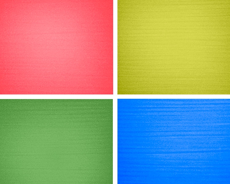 Beispiel einiger UV-aktiven Webgarne - vier Farben: Rot, Gelb, Grün und Blau