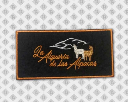 Patch Aufnäher gestickt mit gesticktem Rand schwarz orange Firma