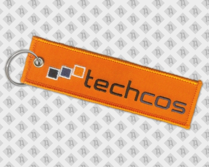 Gestickter Schlüsselanhänger mit Öse und Schlüsselring und dem Motiv "Techcos"